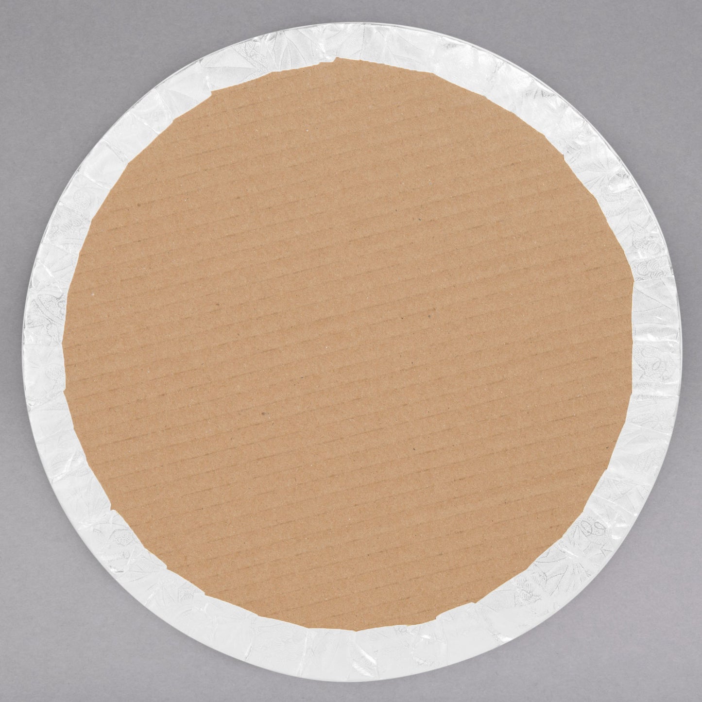 image of the back of a 12 inch white round cake drum that is a qtr inch thick