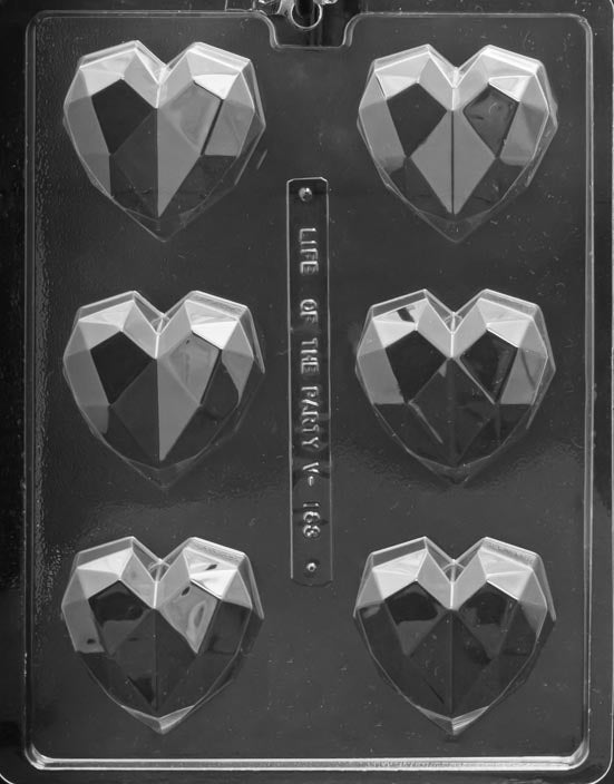 Image of a plastic mold for chocolate. The mold has 6 geometric heart shaped cavities. Each heart shaped cavity is about 2.5 inches by 3 inches 
