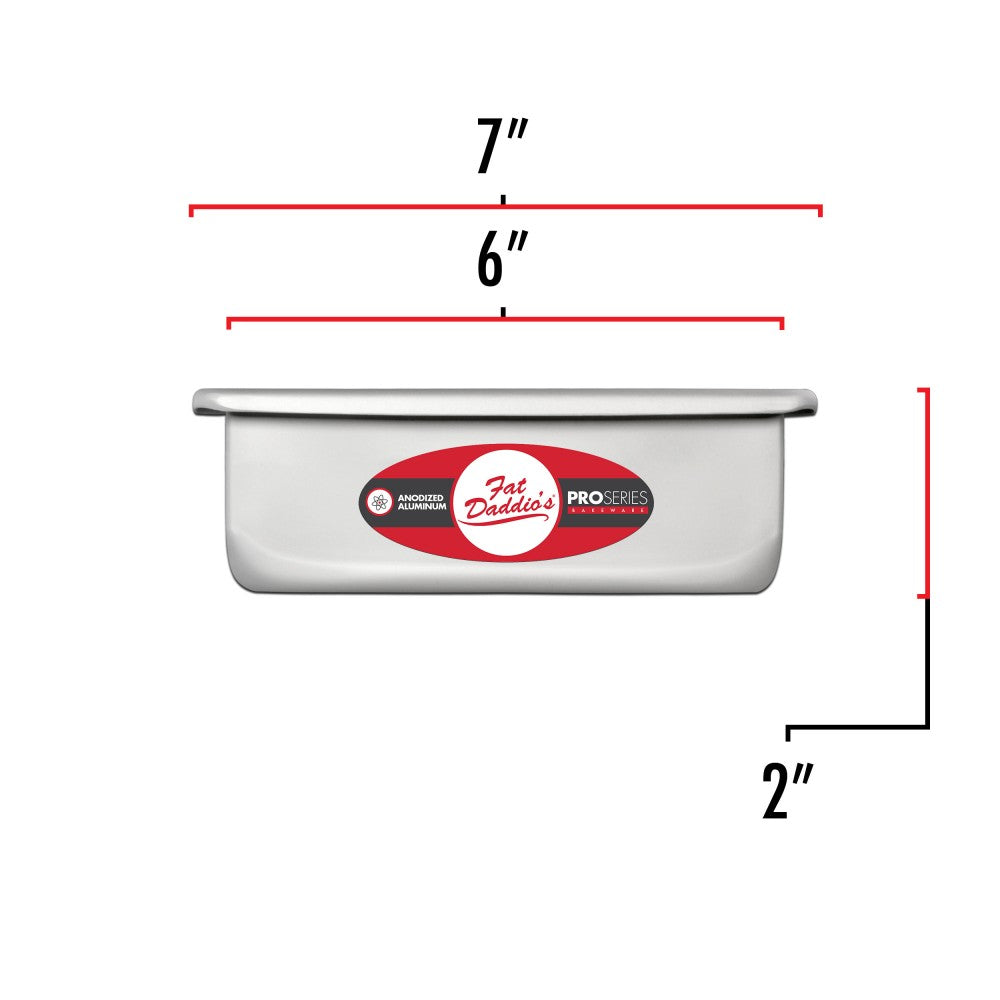 image shows the dimensions of a 6 inch square cake pan. the outer dimension is 7 inch square and the inner dimension is a 6 inch square. the depth is 2 inches.