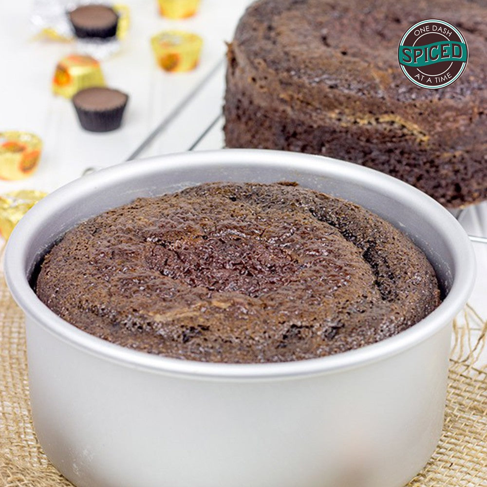 image chocolate cake baked in a round fat daddios pan that is 3 inches deep