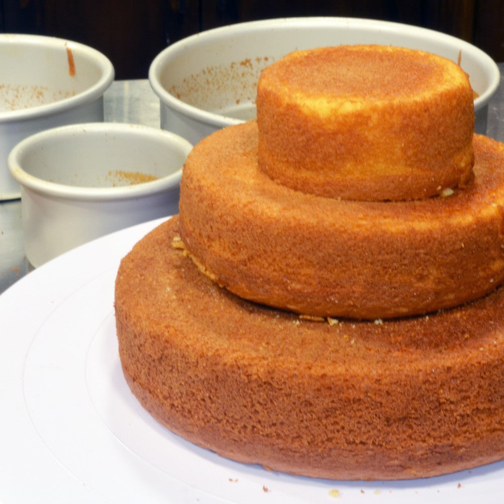image of a mini tiered cake baked with the fat daddios 3 pan cake set