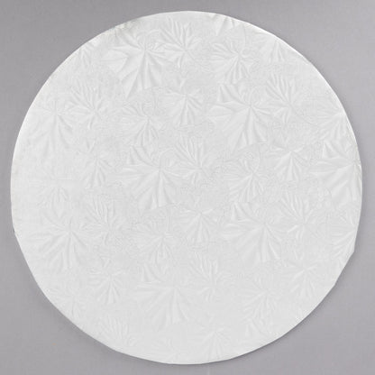 image of 10 inch round white cake drum that is 1/4 inch thick